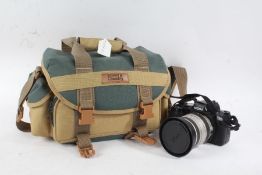 Sigma SA-300 camera body, with a Zoom f/3.8-5.6 lens, in a canvas bag