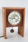 20th century mantle clock, the white dial with Roman numerals and visible escapement, 28cm high