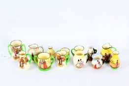 Collection of miniature Royal Doulton Dickensian porcelain, to include jugs and tankards (13