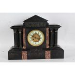 Victorian black slate mantle clock, the white dial with Arabic numerals, with a arched pediment