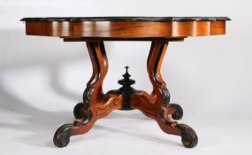 Early 20th Century French walnut extending dining table, the shaped top with ebonised border, raised