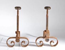Pair of steel firedogs, the squat bun form terminals above square stems and scrolled feet, 24cm