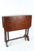 Victorian mahogany drop leaf Sutherland table with a rectangular top above turned legs and