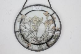 20th century circular glass panel with floral design with a lead edge monogrammed with DML to the