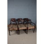 A set of six 19th century mahogany dining chairs, with a reeded cresting rail above a red and gold