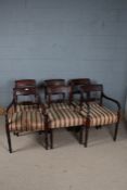 A set of six 19th century mahogany dining chairs, with a reeded cresting rail above a red and gold