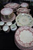 Quantity of early 20th century porcelain tea ware, decorated with pink branches on a white ground,