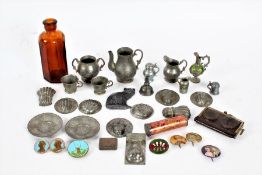 A collection of mostly miniature pewter items including plates, ewers, jugs, moulds together with