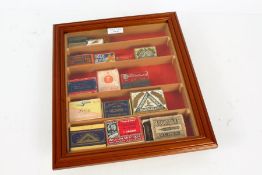 Collection of antique fountain pen nib boxes some filled housed within a glazed display case, 35cm