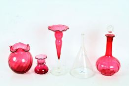 Four items of cranberry glass ware, to include three vases and a decanter, and a Victorian glass