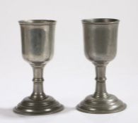 Pair of late 19th Century pewter goblets, the bowls with flared rims above knopped stems and domed