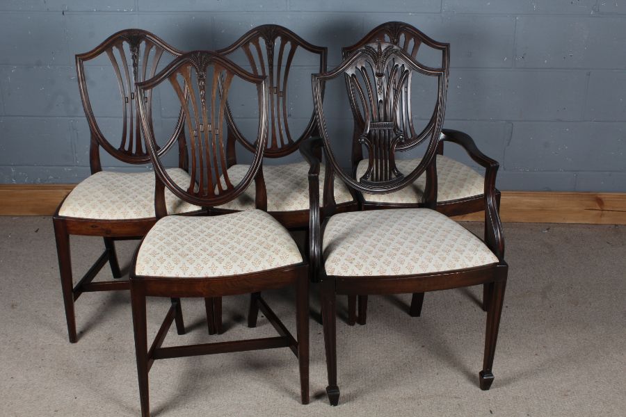 Five Hepplewhite style mahogany dining chairs, comprising four standard and one carver (5)