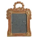 A 19th Century French gilt wood mirror, the rectangular mirror plate within a carved frame and