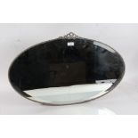 20th century oval mirror with a beveled edge, 70cm wide