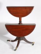 Regency mahogany two tier dumb waiter, with two drop flap tears and turned columns above a splayed