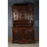 A large 20th century oak cupboard in the Victorian style, with a cupboard base with two doors