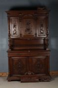 A large 20th century oak cupboard in the Victorian style, with a cupboard base with two doors