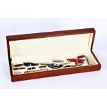 Collection of miniature penknives some in the form of shoes etc housed within a wooden display box -