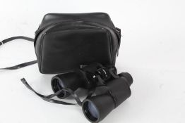 Tasco 10x50mm zip focus binculars housed within a leather bag