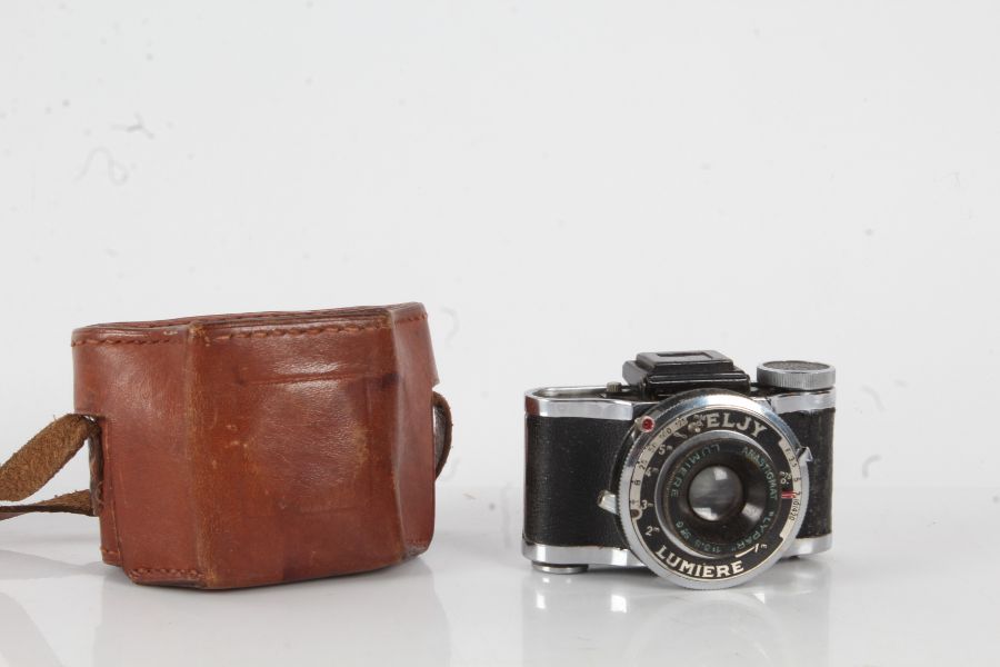 A Lumiere Eljy rollfilm camera housed within a leather carrying case