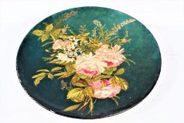Late Victorian/Edwardian pottery charger, hand painted with pink and white flowers on a dark green