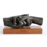 20th century metal sculpture, depicting two clasped hands, initialled SC and numbered 7/30,