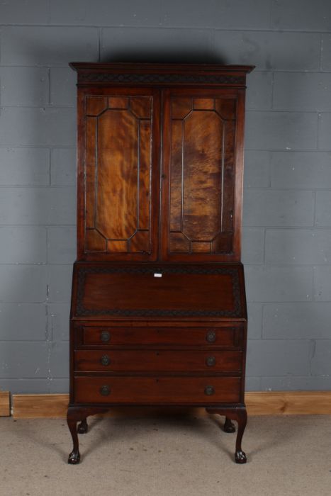 Edwardian mahogany bureau bookcase, the glazed upper section above a sloping fall enclosing a pigeon