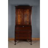 Edwardian mahogany bureau bookcase, the glazed upper section above a sloping fall enclosing a pigeon