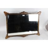 20th century Chinoiserie black lacquered mirror, with gilt accents, depicting scenes and beveled