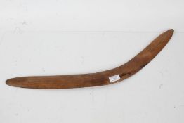 20th century wooden boomerang of typical form, 65cm long