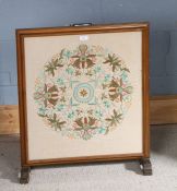 20th century needlework firescreen with a foliate decorated panel, 67cm high 57cm wide