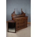 Victorian mahogany dressing chest, with a foliate carved mirror, the top set with four drawers and a