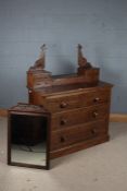 Victorian mahogany dressing chest, with a foliate carved mirror, the top set with four drawers and a