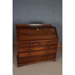 George III oak and mahogany crossbanded bureau, having a later gallery above a sloping fall