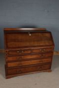 George III oak and mahogany crossbanded bureau, having a later gallery above a sloping fall