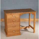 Pine desk bench, the pedestal containing four drawers, 102cm wide