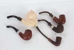 Collection of 19th/20th century pipes to include an exaple modeled as a bearded gentleman, another