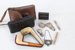 Collection of works of art to include a cased clay pipe, May Fair cased camera, rolled gold