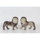 Pair of porcelain lions in grey and white, 22cm long 19cm high