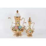 Two large gold lustre ware coffee pots, with the spout modeled as a swan with a bulbous gadrooned