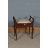 Edwardian mahogany inlaid piano stool, the hinged seat enclosing music books, raised in cabriole