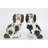 Near pair of Staffordshire spaniels, in black and white, 15cm tall (2)