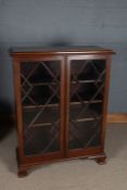 Early 20th century mahogany bookcase, having a pair of astragal glazed doors enclosing adjustable