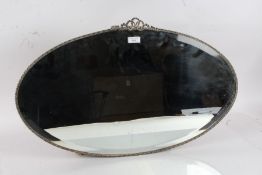 20th century oval mirror with a beveled edge, 70cm wide