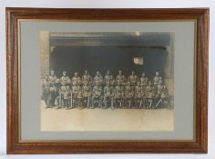 Framed early 20th Century photograph of a Platoon of British Soldiers in Foreign Service uniform,