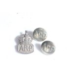 Second World War silver Air Raid Precautions badge, London, 1938, together with two ARP buttons, (
