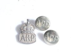 Second World War silver Air Raid Precautions badge, London, 1938, together with two ARP buttons, (