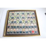 Framed set of cigarette cards showing Royal Navy uniforms and ranks, (2)