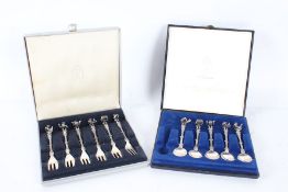 Set of six Dutch silver cake forks and five matching tea spoons, the handles cast as musicians,