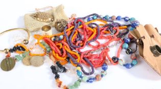 A Collection of costume jewellery to include a yellow metal brooch, beaded necklaces etc (Qty)